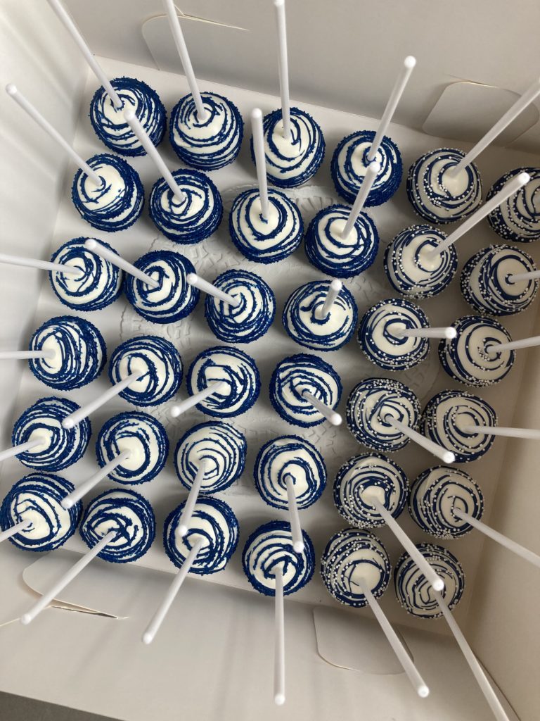 Blue and white graduation cake pops