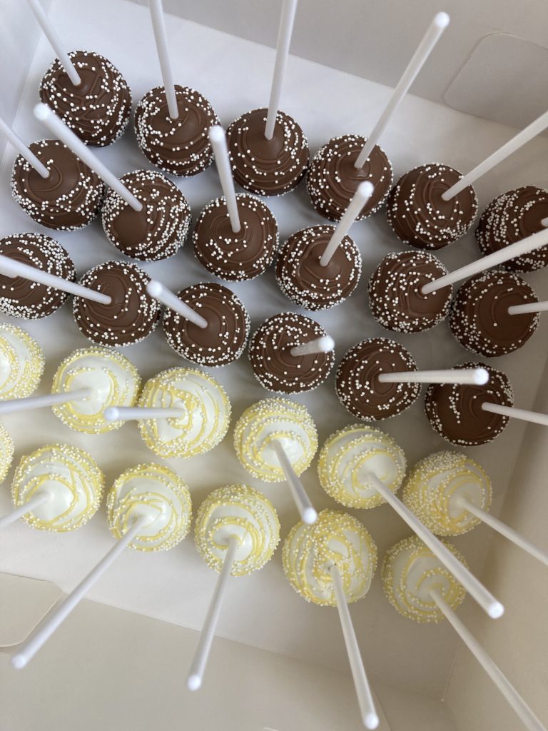 Chocolate and vanilla cake pops on a platter