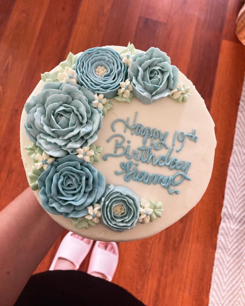 Happy birthday cake with blue flowers