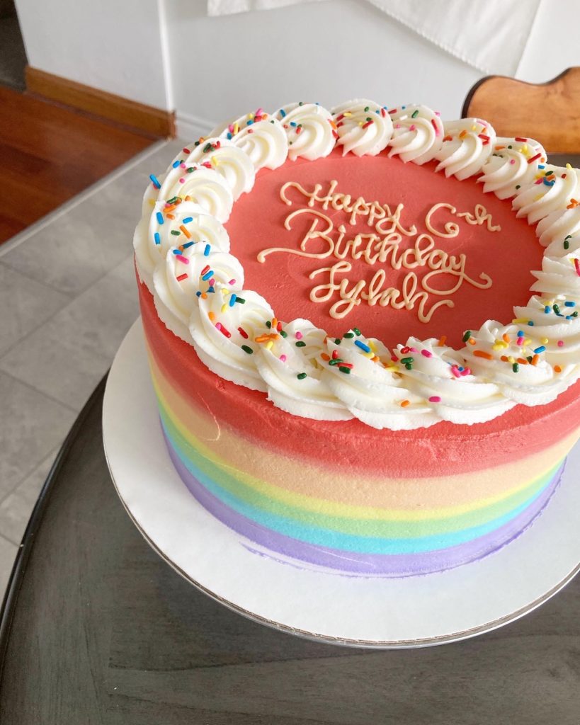 Rainbow birthday cake on a table