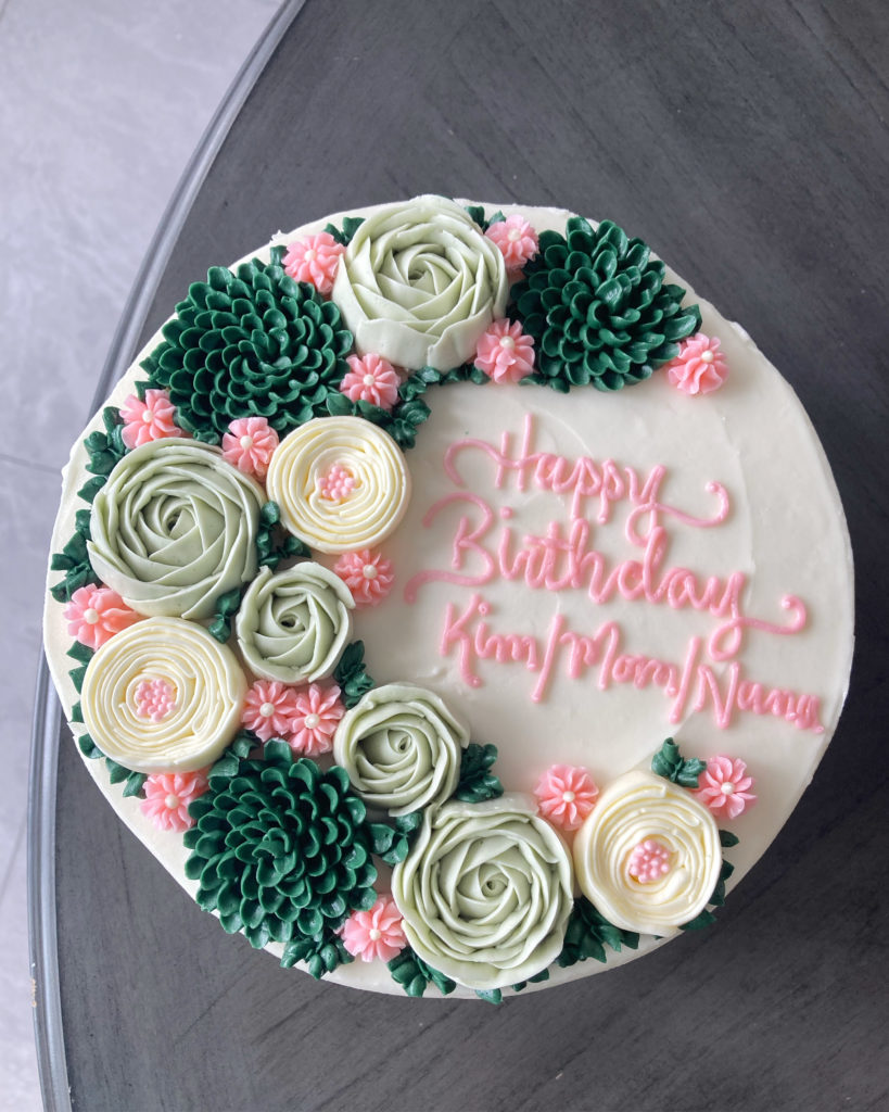 Happy birthday cake with floral spray