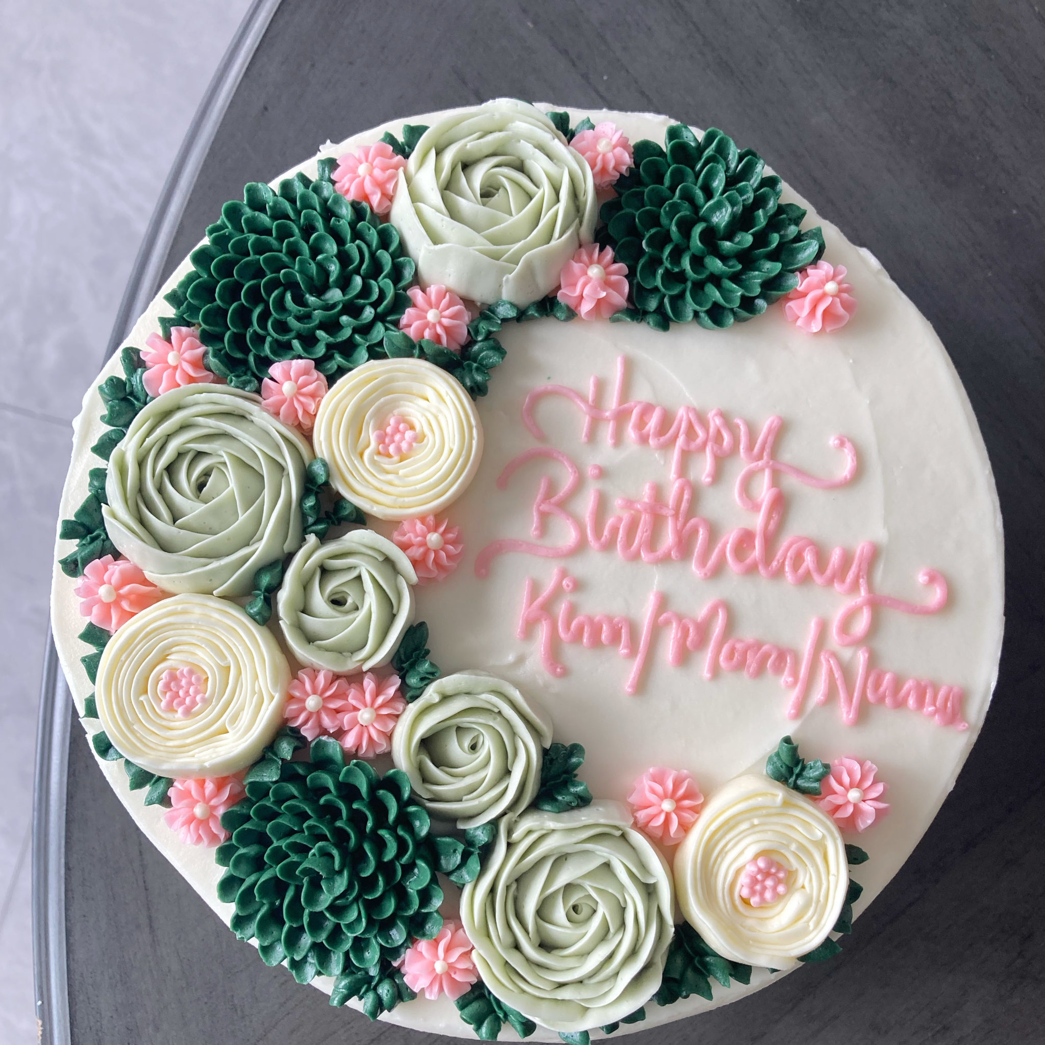 Happy birthday cake with floral spray