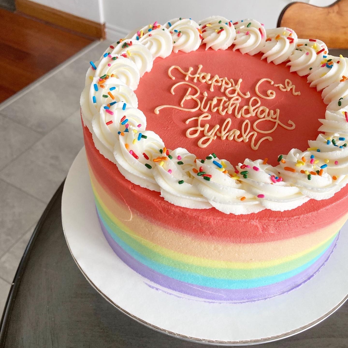 Rainbow birthday cake on a table